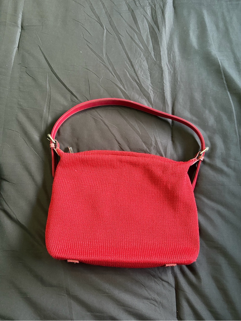 The Sak red textured knit handbag.